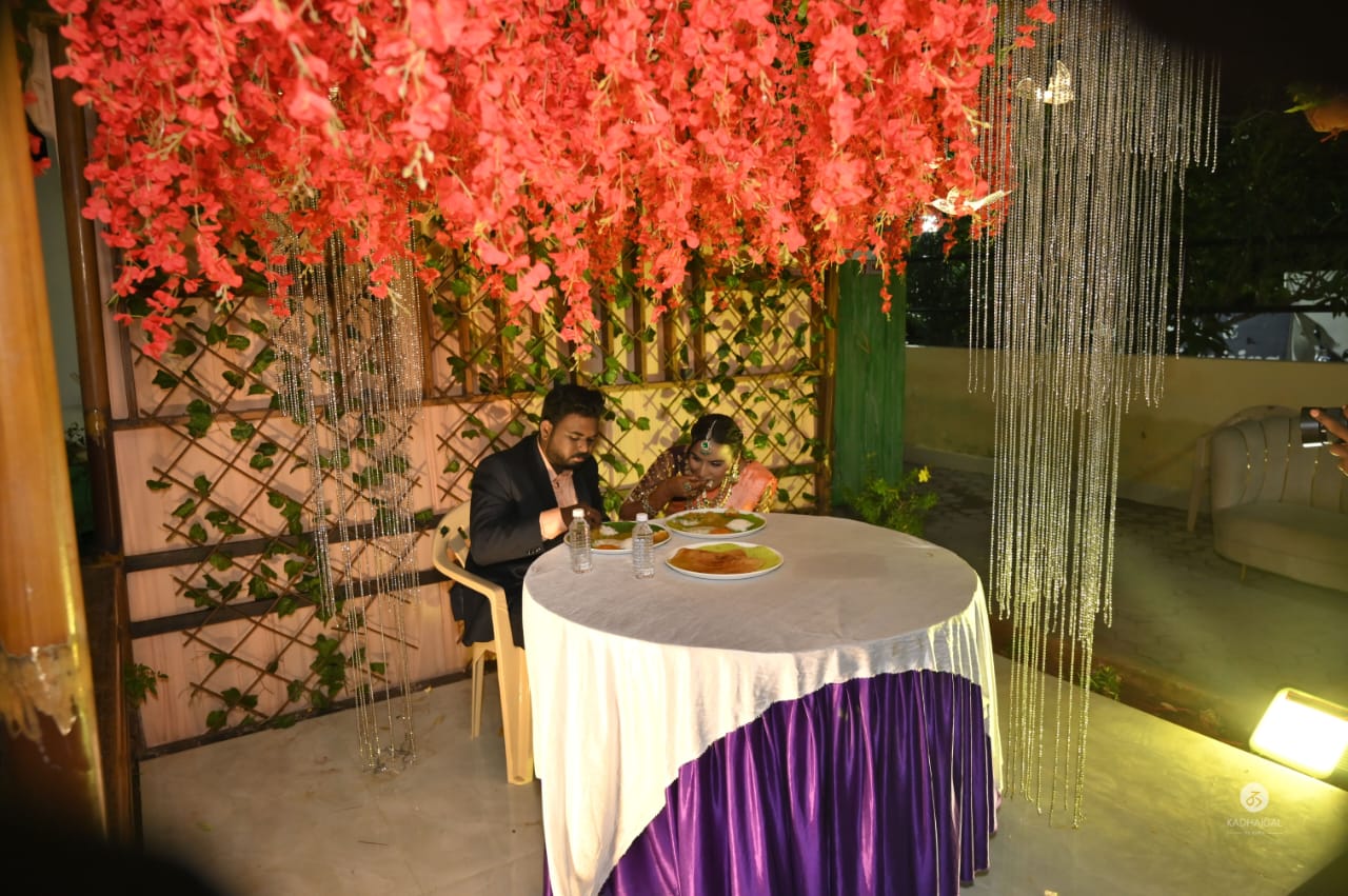Couple seated at a decorated dining table