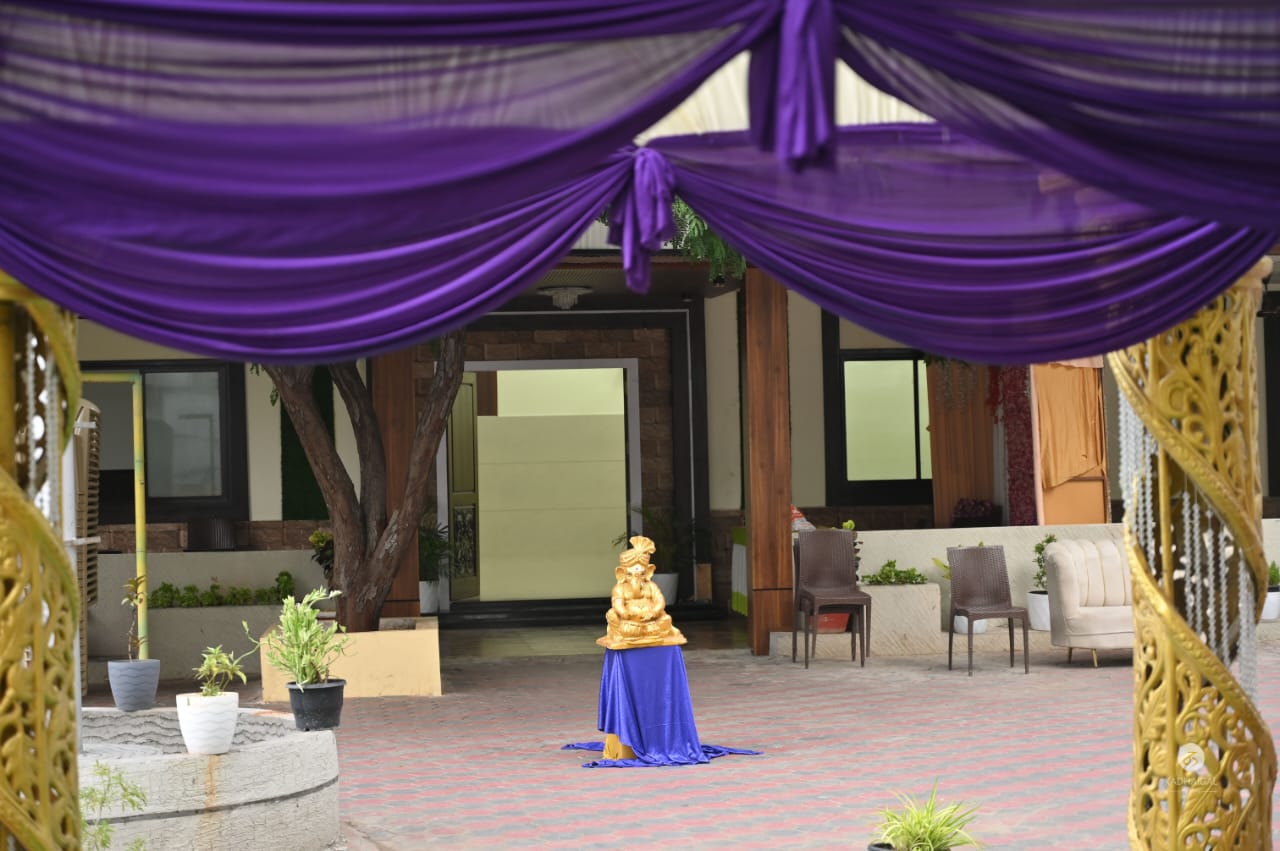 Lobby seating area with golden Ganesha statue