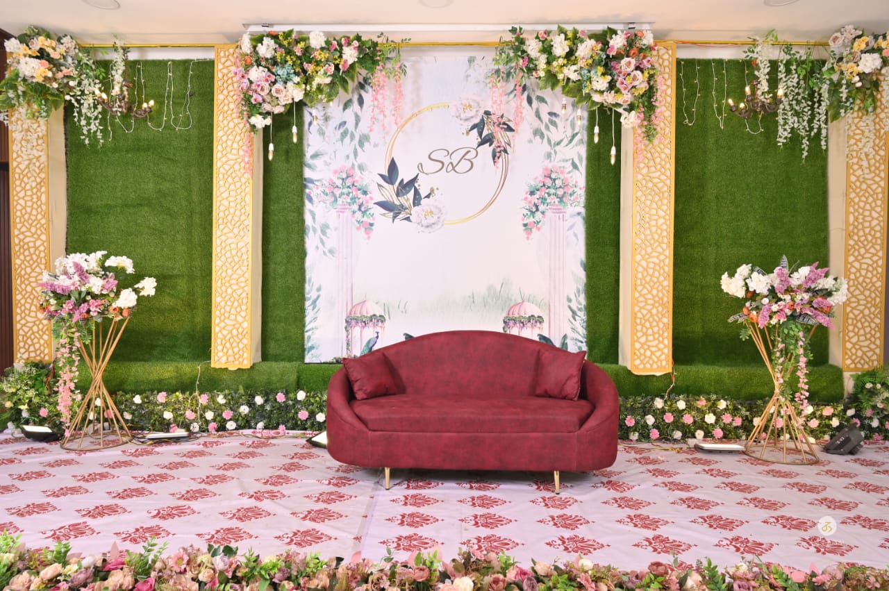 Signature stage decor with floral arch, daylight